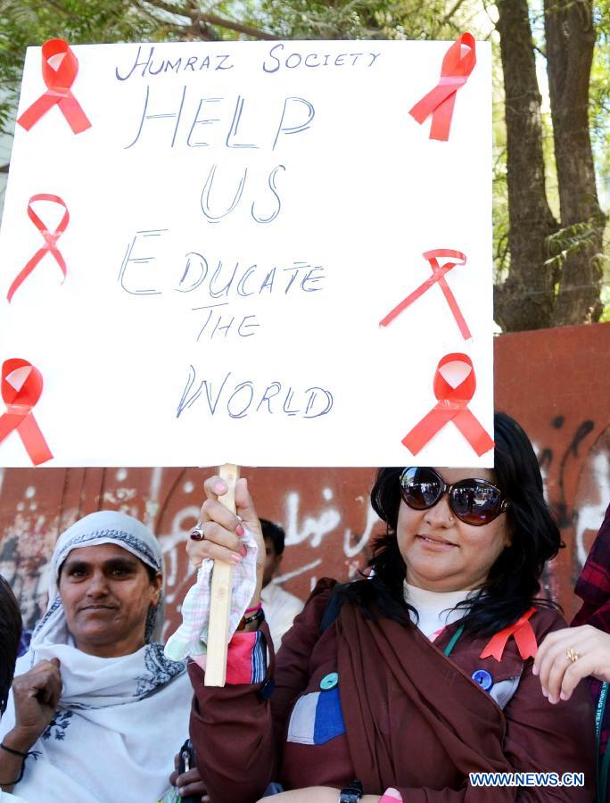 A Pakistani woman holds a placard during a rally to mark the World Aids Day in southern Pakistan's Hyderabad, Dec. 1, 2012. The World AIDS Day which is annually observed on Dec. 1, is dedicated to raising awareness of the AIDS pandemic caused by the spread of HIV infection. (Photo/Xinhua)