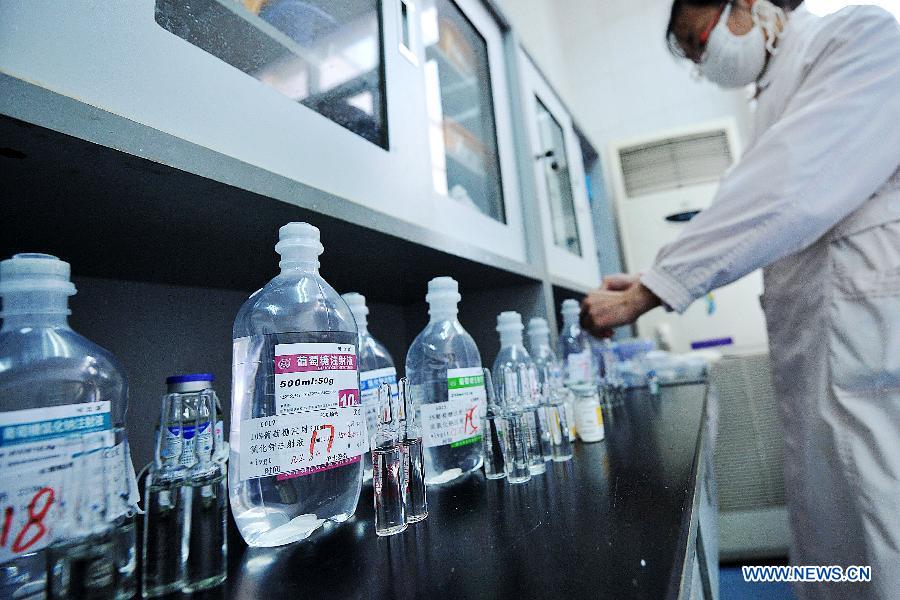 A nurse prepares injections for patients at the Yunnan HIV/AIDS Care Center in Anning City, southwest China's Yunnan Province, Dec. 1, 2012. (Xinhua/Lin Yiguang) 