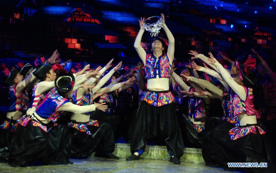 Dance drama "Zuo Ye", a traditional love and social activity of the Dong ethnic group, is performed during a festival in Sanjiang Dong Autonomous County of Liuzhou City, southwest China's Guangxi Zhuang Autonomous Region, Nov. 30, 2012. (Xinhua/Lai Liusheng) 