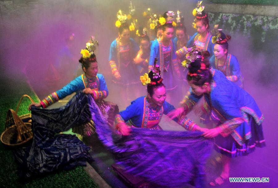 Dance drama "Zuo Ye", a traditional love and social activity of the Dong ethnic group, is performed during a festival in Sanjiang Dong Autonomous County of Liuzhou City, southwest China's Guangxi Zhuang Autonomous Region, Nov. 30, 2012. (Xinhua/Lai Liusheng) 