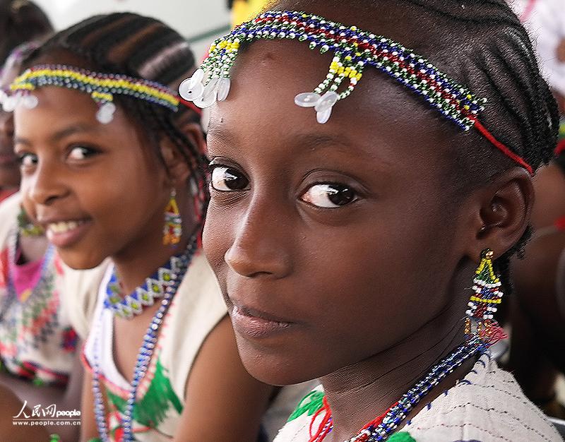 Children smile toward the lens.