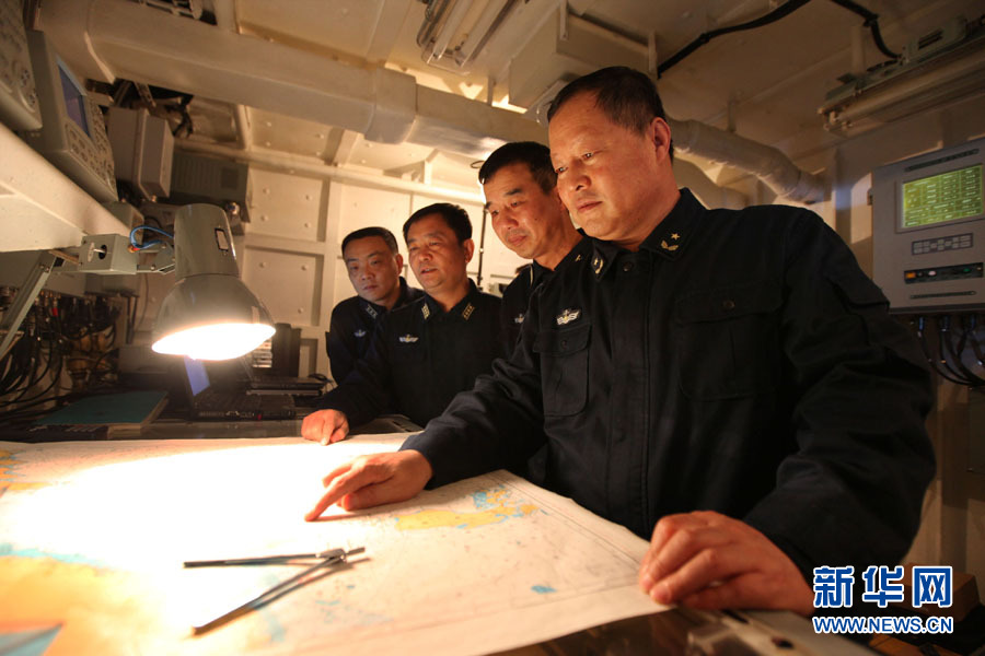 A fleet of the Navy of the Chinese People's Liberation Army (PLA) conducts search and rescue drills with a helicopter, in the western Pacific Ocean on December 1, 2012. (Xinhua/Sun Yanxin)