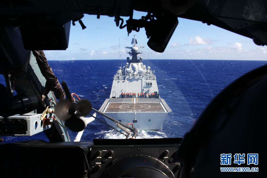 A fleet of the Navy of the Chinese People's Liberation Army (PLA) conducts search and rescue drills with a helicopter, in the western Pacific Ocean on December 1, 2012. (Xinhua/Sun Yanxin)