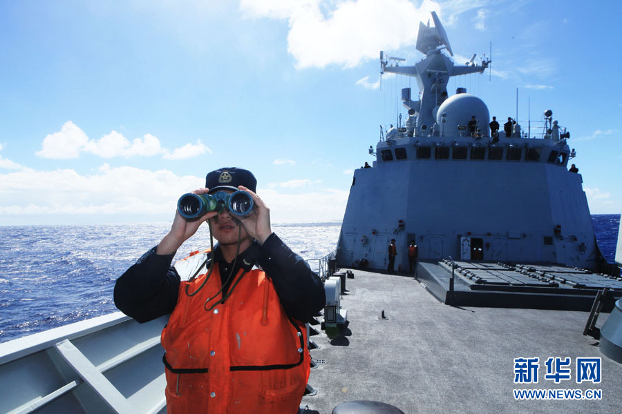 A fleet of the Navy of the Chinese People's Liberation Army (PLA) conducts search and rescue drills with a helicopter, in the western Pacific Ocean on December 1, 2012. (Xinhua/Sun Yanxin)