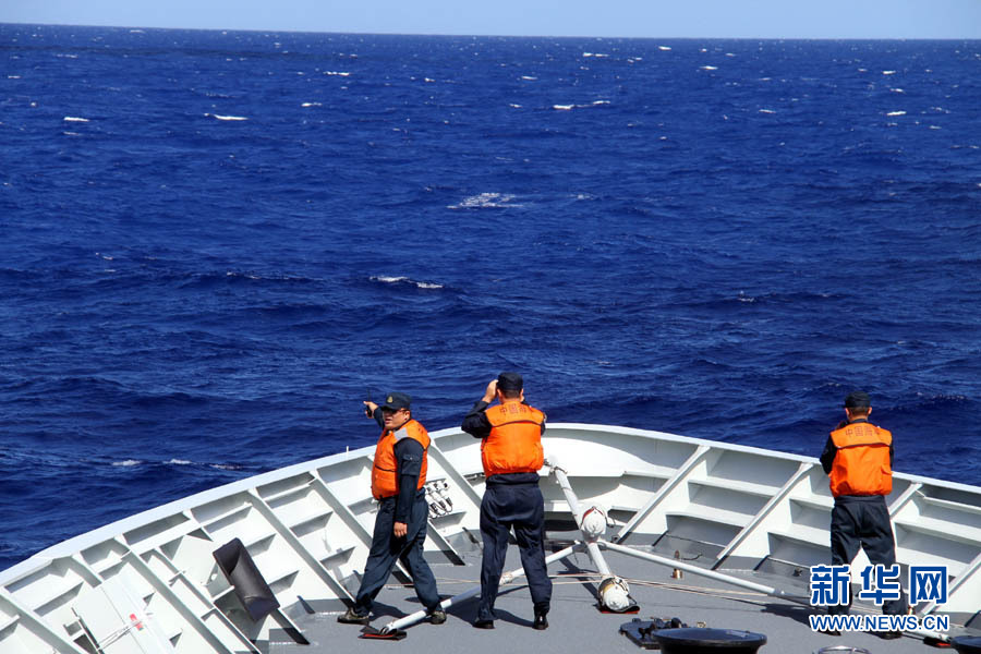 A fleet of the Navy of the Chinese People's Liberation Army (PLA) conducts search and rescue drills with a helicopter, in the western Pacific Ocean on December 1, 2012. (Xinhua/Sun Yanxin)