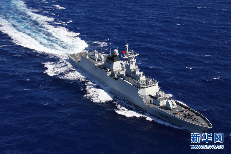 A fleet of the Navy of the Chinese People's Liberation Army (PLA) conducts search and rescue drills with a helicopter, in the western Pacific Ocean on December 1, 2012. (Xinhua/Sun Yanxin)