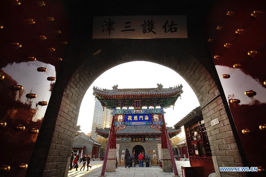 Tourists visit the Tianhou Temple in north China's Tianjin Municipality, Dec. 3, 2012. The Tianhou Temple completed its repair work and was opened to society on Monday. (Xinhua/Wang Xiaoming) 