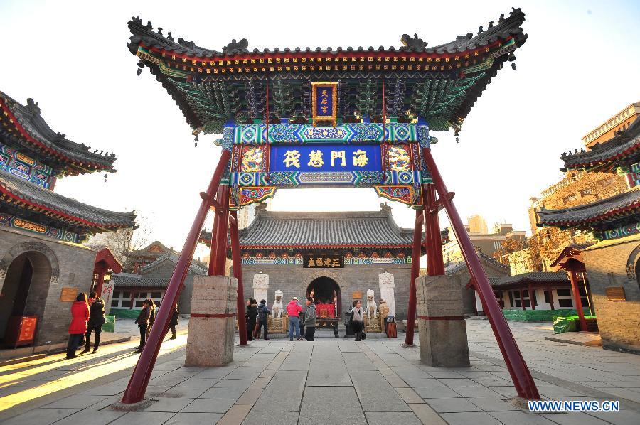 Tourists visit the Tianhou Temple in north China's Tianjin Municipality, Dec. 3, 2012. The Tianhou Temple completed its repair work and was opened to society on Monday. (Xinhua/Wang Xiaoming) 