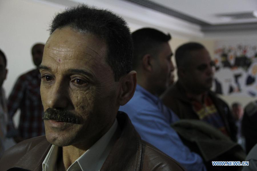 Members of Fatah movement arrive at the Rafah crossing with Egypt in the southern Gaza Strip, on Dec. 3, 2012. A total of 11 members of Palestinian Fatah movement, who fled Gaza into Egypt in 2007 during internal fighting between the two political rivals, returned home on Monday following an amnesty by the Hamas ruling government. (Xinhua/Khaled Omar) 