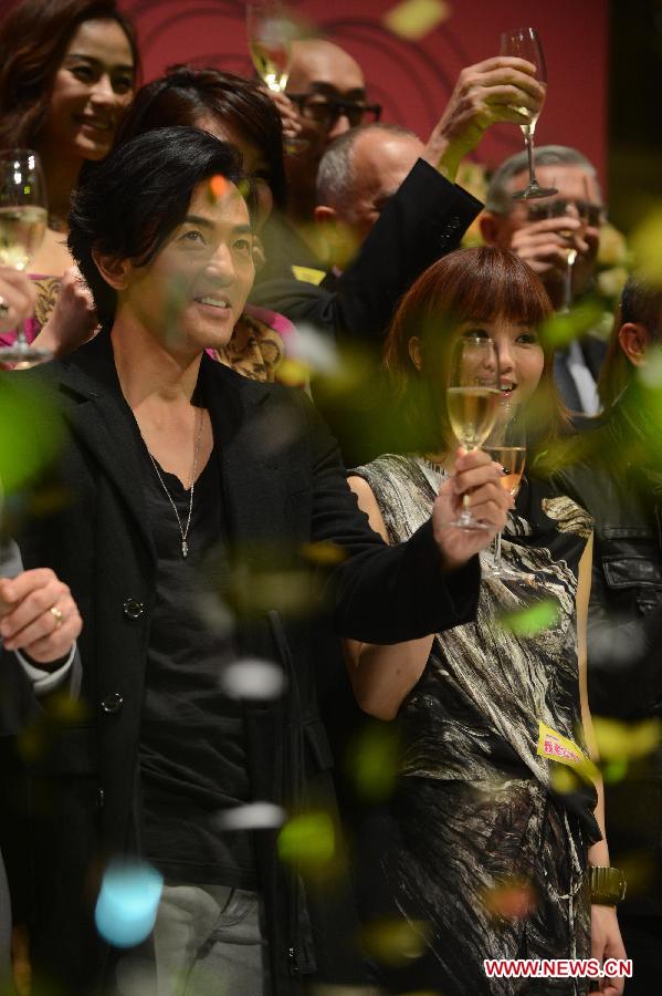 Actress Charlene Choi (R, front) and actor Cheng Yee-Kin (L, front) attend the premiere of their new movie "My Sassy Hubby" in south China's Macao, Dec. 4, 2012. (Xinhua/Cheong Kam Ka) 