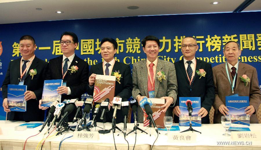 Guests pose for a group picture at a media conference for the 11th China City Competitiveness Ranking released by China Institute of City Competitiveness in south China's Hong Kong, Dec. 5, 2012. The top three Chinese cities of the comprehensive competitiveness ranking are Hong Kong, east China's Shanghai Municipality and China's capital Beijing. (Xinhua/Jin Yi)