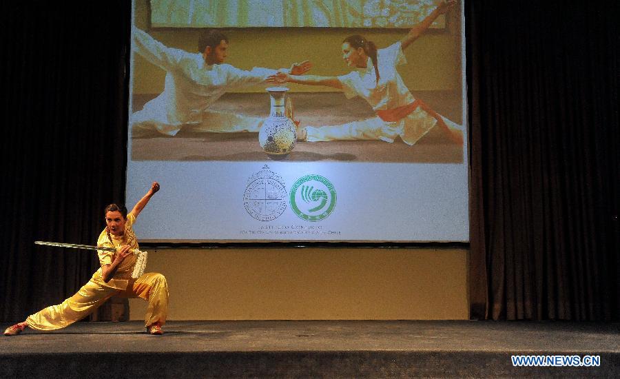 A student of the Confucius Institute of the Pontifical Catholic University of Chile performs at an event marking the end of the year for students of Chinese language and Chinese culture in Santiago, capital of Chile, on Dec. 5, 2012.(Xinhua/Jorge Villegas)