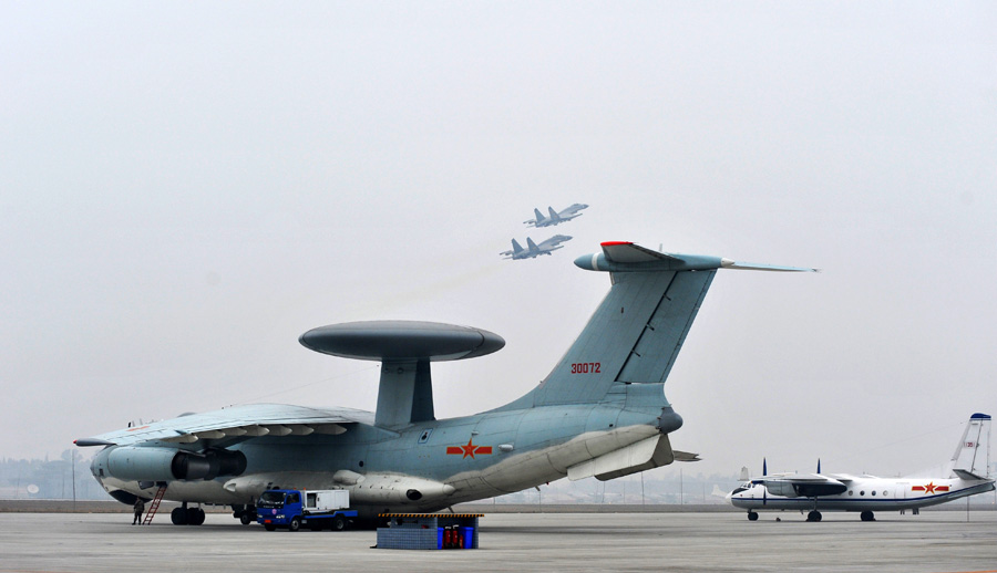 A comprehensive support experiment drill with multi-types of fighters on the double-runway under information conditions was recently held by the Air Force of the Chinese People's Liberation Army (PLA) at an airport in southwest China. Nearly 100 fighters of over 10 different types open the curtain of the base-oriented transformation of the combat support mode of the PLA Air Force.The use of the double-runway airport greatly enhances airport capacity and flight service efficiency. (Xinhua/Peng Guangxian)