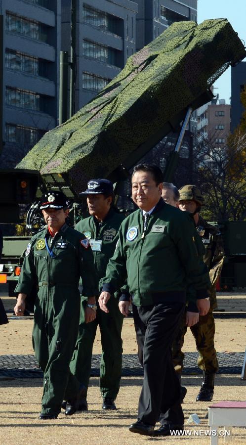 Japanese Prime Minister Yoshihiko Noda (Front) inspects the PAC-3 (Patriot Advanced Capability-3) missile unit in Tokyo, Japan, Dec. 7, 2012. Japanese government has deployed PAC-3 missiles in Tokyo and Okinawa after the Democratic People's Republic of Korea (DPRK) announced their satellite launch plan. (Xinhua/Ma Ping)