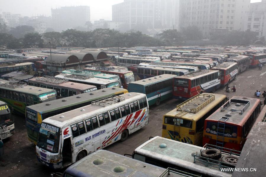 Long journey buses park in a bus station during Bangladesh Nationalist Party (BNP) led alliance 18-party countrywide road block protest in Dhaka, capital of Bangladesh, Dec. 9, 2012. Four people were claimed to be dead with 600 others injured when Bangladesh's anti-government protesters and their ruling party rivals fought pitched battles for hours in capital Dhaka and elsewhere in the country Sunday morning. (Xinhua/Shariful Islam)