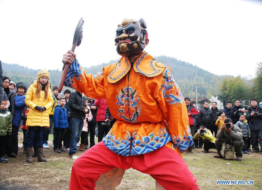 File photo taken on Jan. 24, 2012 shows a Nuo dance artist giving performance in Changjing Village of Wuyuan County, east China's Jiangxi Province. (Xinhua/Zhang Weiguo)