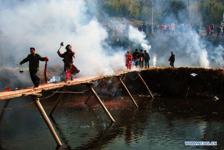 File photo taken on Feb. 4, 2011 shows Nuo dance artists give performance in Changjing Village of Wuyuan County, east China's Jiangxi Province. (Xinhua/Zhang Weiguo)