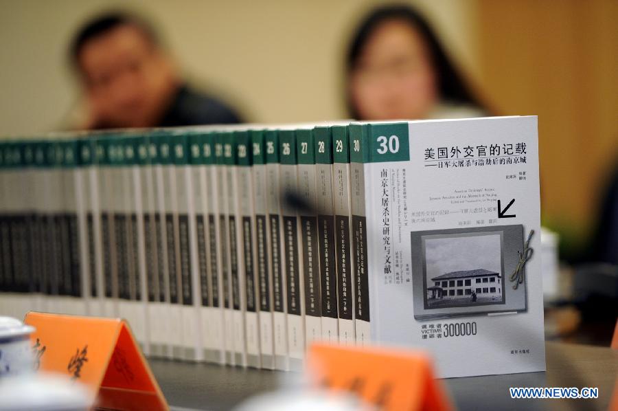 The launching ceremony of a series of books about Nanjing Massacre is held at the Memorial Hall of the Victims in Nanjing Massacre in Nanjing, capital of east China's Jiangsu Province, Dec. 10, 2012. (Xinhua/Han Yuqing) 