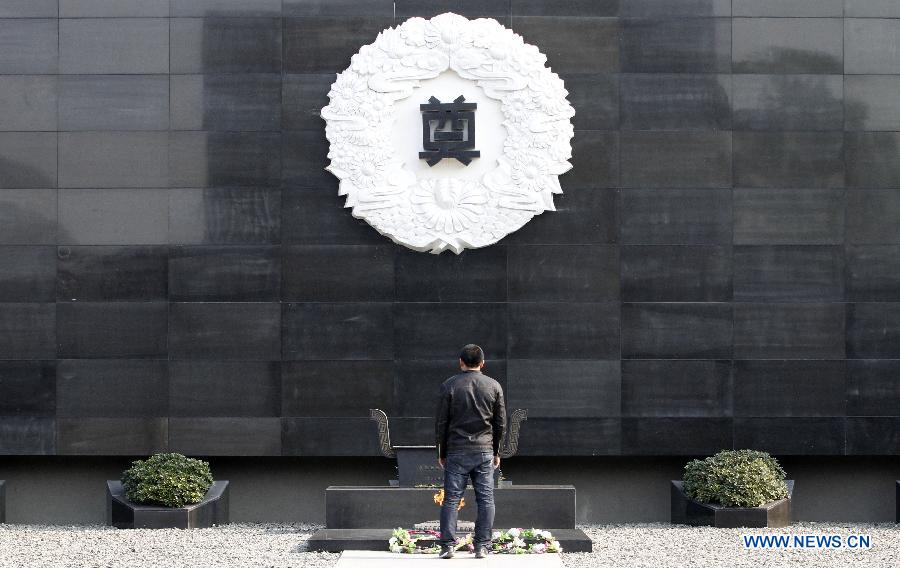 A man mourns vicitims at the Memorial Hall of the Victims in Nanjing Massacre by Japanese Invaders during the World War II in Nanjing, capital of east China's Jiangsu Province, Dec. 11, 2012. A series of memorial activities will be held to commemorate the 75th anniversary of the Nanjing Massacre that left some 300,000 Chinese dead when the Japanese occupied Nanjing on Dec. 13, 1937 and began a six-week massacre. (Xinhua/Dong Jinlin)