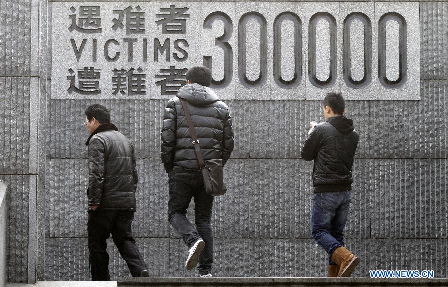 People visit the Memorial Hall of the Victims in Nanjing Massacre by Japanese Invaders during the World War II in Nanjing, capital of east China's Jiangsu Province, Dec. 11, 2012. A series of memorial activities will be held to commemorate the 75th anniversary of the Nanjing Massacre that left some 300,000 Chinese dead when the Japanese occupied Nanjing on Dec. 13, 1937 and began a six-week massacre. (Xinhua/Dong Jinlin)