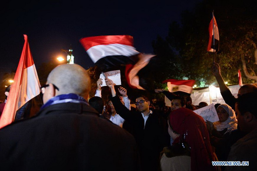 Egyptian opposition supporters gather outside the Presidential Palace to protest against the upcoming referendum on the new draft constitution in Cairo, Egypt, on Dec. 11, 2012. (Xinhua/Qin Haishi) 