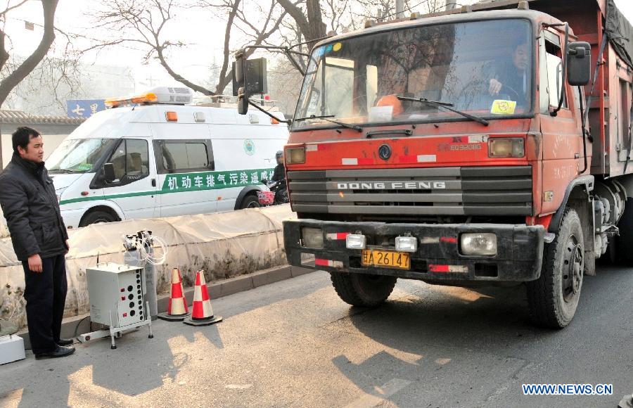 A remote emission test equipment is seen on the street in Lanzhou, capital of northwest China's Gansu Province, Dec. 12, 2012. Two vehicles with the test system have been put into operation in Lanzhou recently. The system could collet and analyse emission data from a vehicle and record the vehicle number through a remote sensoring equipment without interrupting the traffic. (Xinhua/Huang Wenxin) 