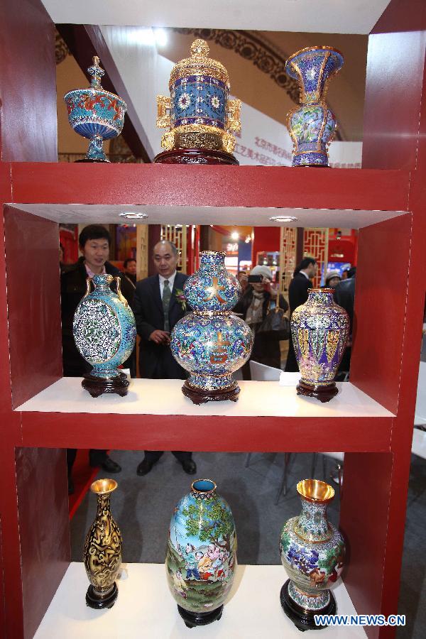 Cloisonne vases are displayed at the Beijing pavilion during the 2012 China Time-Honoured Brand Expo in Beijing, capital of China, Dec. 12, 2012. The five-day expo, opening Wednesday at the Beijing Exhibition Center, attracted some 160 Chinese time-honoured brand exhibitors. (Xinhua)