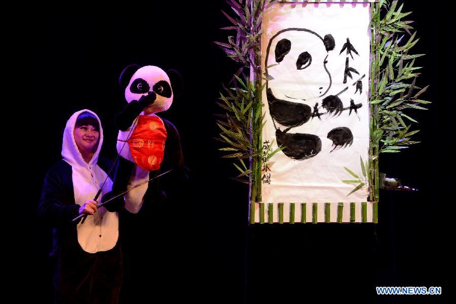 An artist controls a puppet during the 4th national puppet show and shadow play competition in Xi'an, capital of northwest China's Shaanxi Province, Dec. 13, 2012. Sixteen team from the nation would perform 51 shows during the competition.(Xinhua/Li Yibo)