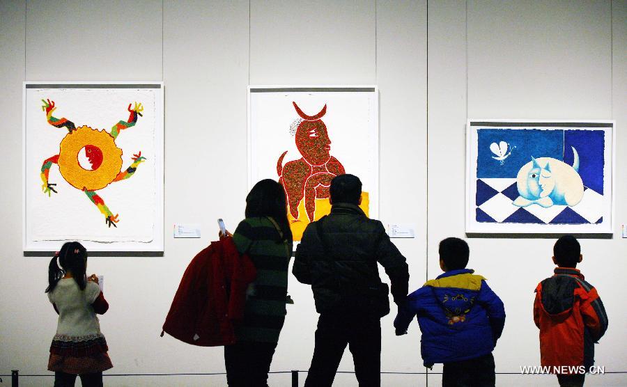 Visitors view artworks of Juan Ripolles, a well-known Spanish painter and sculptor, at his exhibition "Universe Ripolles" in the Jiangsu Provincial Art Museum in Nanjing, capital of east China's Jiangsu Province, Dec. 16, 2012. A total of 86 artworks of Juan Ripolles were displayed at the exhibition, which kicked off on Tuesday. (Xinhua) 