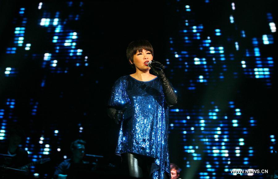 Singer Tiger Wong performs during her concert in Nanjing, capital of east China's Jiangsu Province, Dec. 15, 2012. (Xinhua/Yan Minhang) 