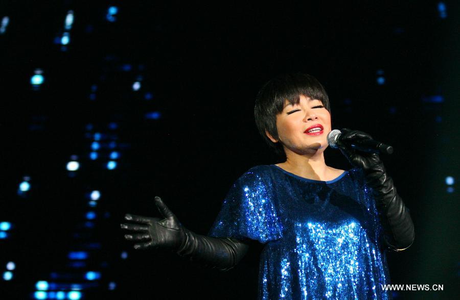 Singer Tiger Wong performs during her concert in Nanjing, capital of east China's Jiangsu Province, Dec. 15, 2012. (Xinhua/Yan Minhang) 