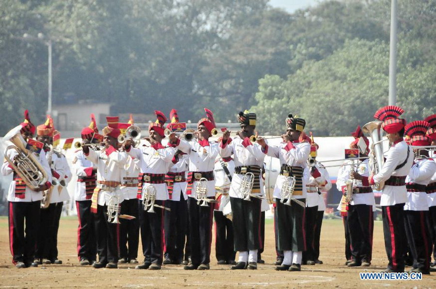 Members of an Indian military band perform during a military drill and arms exhibition at Shivaji park in Mumbai, India, on Dec. 15, 2012. A troop of Indian Defense Ministry held the military drill and arms exhibition here to raise the public awareness of Indian army and military affairs on Saturday. (Xinhua/Wang Ping) 