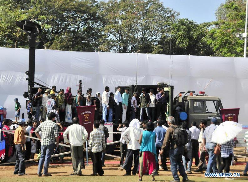 People look at arms exhibition at Shivaji park in Mumbai, India, on Dec. 15, 2012. A troop of Indian Defense Ministry held a military drill and arms exhibition here to raise the public awareness of Indian army and military affairs on Saturday. (Xinhua/Wang Ping) 