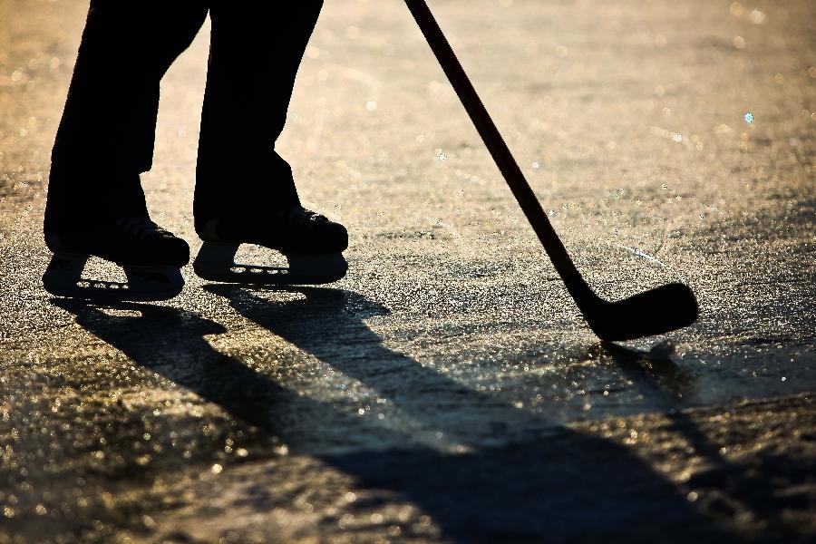 A skater enjoys himself upon the ice in Taoranting Park in Beijing, capital of China, Dec. 17, 2012. (Xinhua/Zhang Cheng)