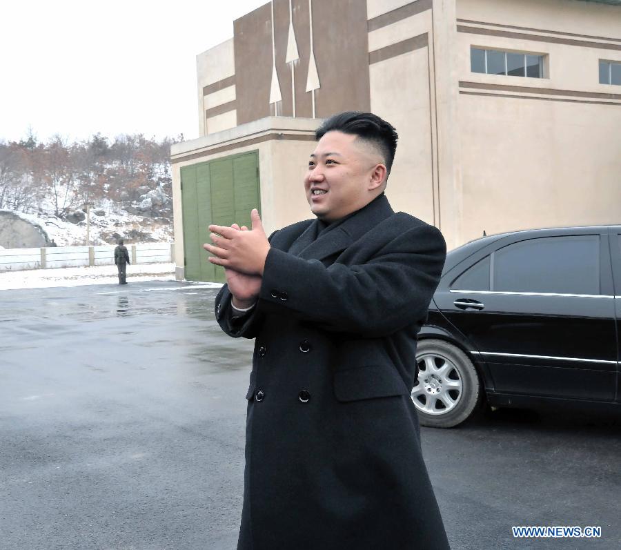 Photo released by Korean Central News Agency (KCNA) on Dec. 16, 2012 shows Kim Jong Un, top leader of the Democratic People's Republic of Korea (DPRK), congratulate recently on scientific workers of the second Kwangmyongsong-3 satellite launch project at Sohae Space Center in Cholsan County, North Phyongan Province, DPRK. (Xinhua/KCNA) 