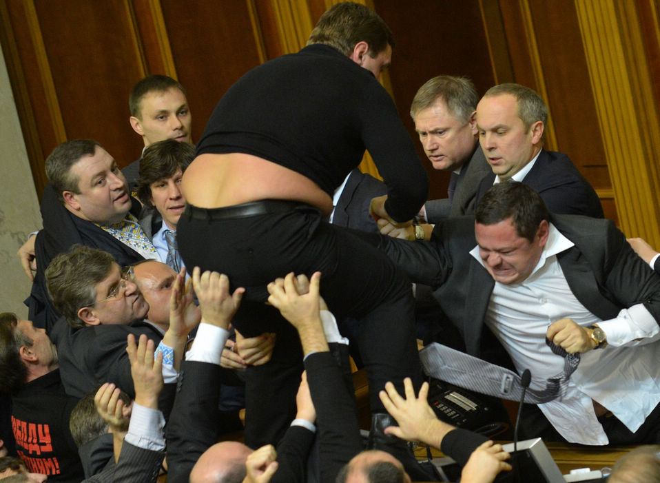 Fists fly at Ukraine's newly elected parliament develops into an all-out brawl between government supporters and opposition lawmakers on December 12, 2012. (Xinhua/Reuter)