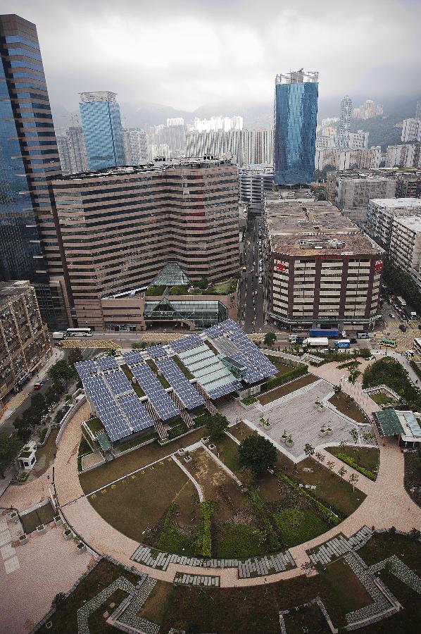 Photo taken on Dec. 17, 2012 shows Hong Kong's first zero-carbon building ZCB in Hong Kong, south China. The building, which generates on-site renewable energy more than operation needs from photovoltaic panels and biodiesel tri-generation system and exports surplus energy to offset embodied energy of its construction process and major structural materials, will be opened to the public on Jan. 5, 2013. (Photo/Xinhua) 