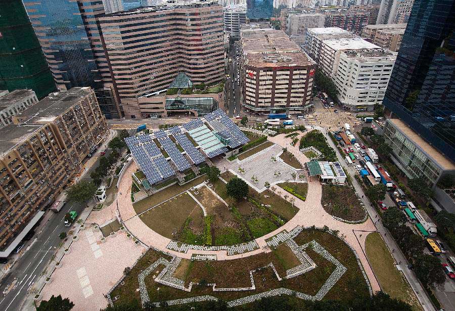 Photo taken on Dec. 17, 2012 shows Hong Kong's first zero-carbon building ZCB in Hong Kong, south China. The building, which generates on-site renewable energy more than operation needs from photovoltaic panels and biodiesel tri-generation system and exports surplus energy to offset embodied energy of its construction process and major structural materials, will be opened to the public on Jan. 5, 2013. (Photo/Xinhua) 