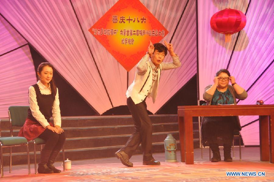 Actors perform during the awarding ceremony of a Chinese Quyi contest in Hohhot, capital of north China's Inner Mongolia Autonomous Region, Dec. 17, 2012. 