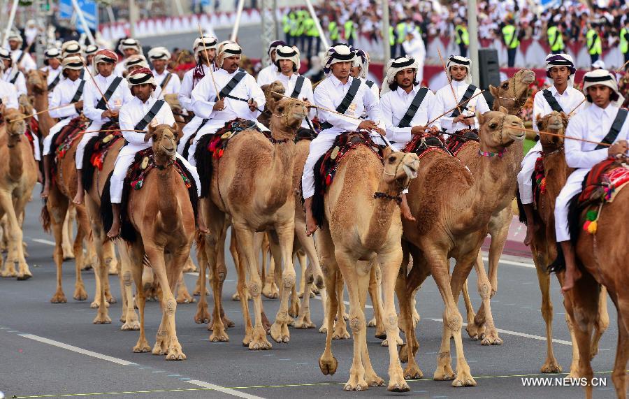 Soldiers take part in a military parade during Qatar's National Day in Doha, Qatar, on Dec. 18, 2012. (Xinhua/Chen Shaojin) 