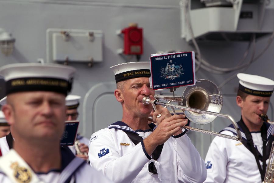 Members of Australian navy orchestra perform during a ceremony to welcome three visiting Chinese navy ships in Sydney, Australia, on Dec. 18, 2012. Three Chinese navy ships returning home from counter-piracy operations in the Gulf of Aden have arrived in Sydney as part of a four day port visit, local media reported on Tuesday. (Xinhua/Jin Linpeng) 