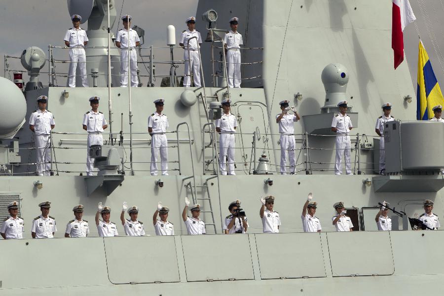 Soldiers stand on Qian Dao Hu, one of the three visiting Chinese navy ships, upon their arrival in Sydney, Australia, on Dec. 18, 2012. Three Chinese navy ships returning home from counter-piracy operations in the Gulf of Aden have arrived in Sydney as part of a four day port visit, local media reported on Tuesday. (Xinhua/Jin Linpeng) 