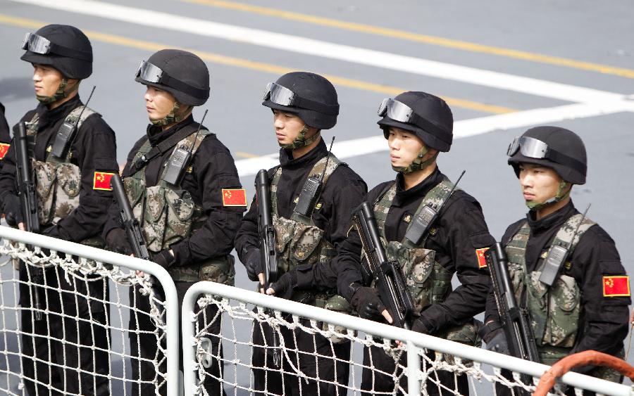 Soldiers stand on Yi Yang, one of the three visiting Chinese navy ships, upon their arrival in Sydney, Australia, on Dec. 18, 2012. Three Chinese navy ships returning home from counter-piracy operations in the Gulf of Aden have arrived in Sydney as part of a four day port visit, local media reported on Tuesday. (Xinhua/Jin Linpeng) 