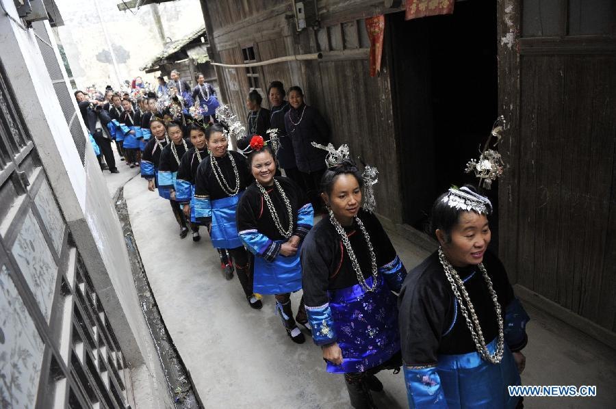 People of the Dong ethnic group take part in an ancestor-worshipping ritual during the Sama Festival in Rongjiang County, southwest China's Guizhou Province, Dec. 19, 2012. As a part of the ongoing celebration of the Sama Festival, an ancient traditional festival commemorating the woman ancestor, a ritual was held on Wednesday to worship a heroine ancestor of the group named Sama. The festival will last untill Dec. 20. (Xinhua/Ou Dongqu) 