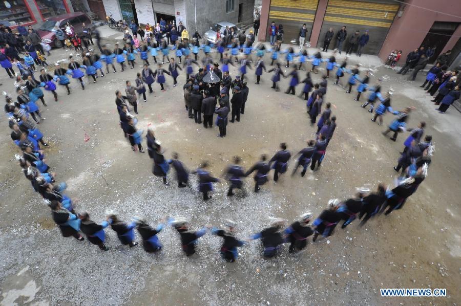 People of the Dong ethnic group take part in an ancestor-worshipping ritual during the Sama Festival in Rongjiang County, southwest China's Guizhou Province, Dec. 19, 2012. As a part of the ongoing celebration of the Sama Festival, an ancient traditional festival commemorating the woman ancestor, a ritual was held on Wednesday to worship a heroine ancestor of the group named Sama. The festival will last untill Dec. 20. (Xinhua/Ou Dongqu)