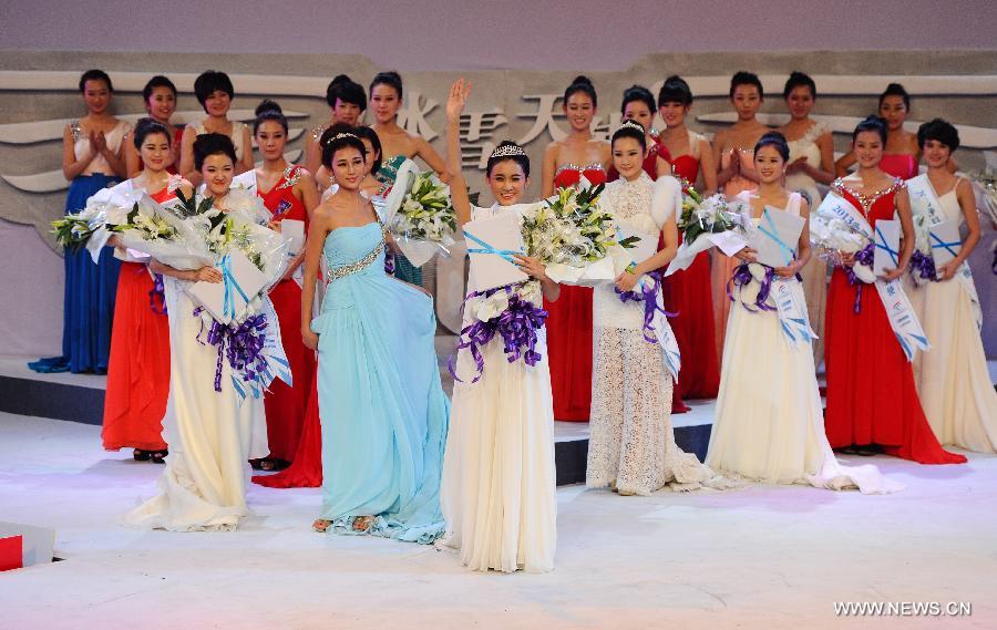 Contestants attend the award ceremony of a beauty contest in Changchun City, capital of northeast China's Jilin Province, Dec. 19, 2012. (Xinhua/Xu Chang)  