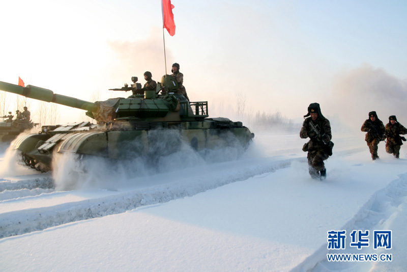 An armored regiment under the Shenyang Military Area Command of the Chinese People's Liberation Army (PLA) took its troops to unfamiliar area on December 16, 2012 to conduct drill on such subjects as rapid maneuvering and coordination of infantrymen and tanks, in a bid to temper its troops in an all-round way. (Xinhua/Xu Zhilin)