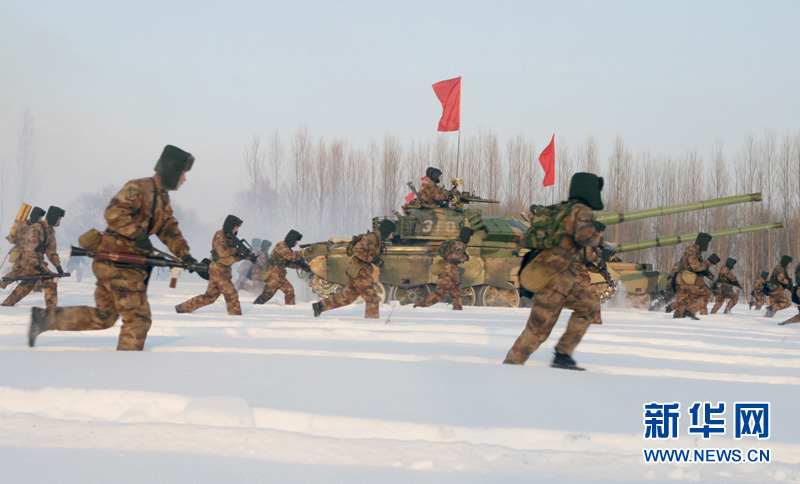 An armored regiment under the Shenyang Military Area Command of the Chinese People's Liberation Army (PLA) took its troops to unfamiliar area on December 16, 2012 to conduct drill on such subjects as rapid maneuvering and coordination of infantrymen and tanks, in a bid to temper its troops in an all-round way. (Xinhua/Xu Zhilin)