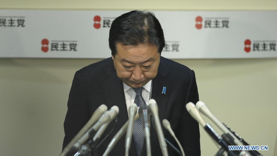 Japan's outgoing Prime Minister Yoshihiko Noda bows during a meeting of the lawmakers of the Democratic Party of Japan (DPJ), in Tokyo, on Dec. 19, 2012. The Democratic Party of Japan (DPJ) on Wednesday postponed its leadership election scheduled for Saturday after the party encountered a fiasco in lower house race held on Sunday. (Xinhua/Kenichiro Seki) 