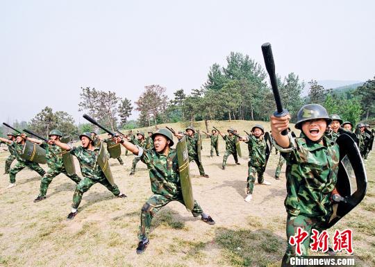 The picture shows that wushu masters are in training. (File Photo)